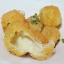 Fried Manchego Cheese Cubes with Citrus Honey Drizzle ($8).