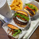 Hamburger Single ($7.90), Shack Burger ($9.70), Black Truffle Burger Single ($14), Fries ($4.50)
