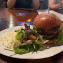 Double cheeseburger with salad and coleslaw