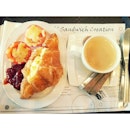 Breakfast for the day, croissant w/ scramble eggs and a cup of premium coffee.