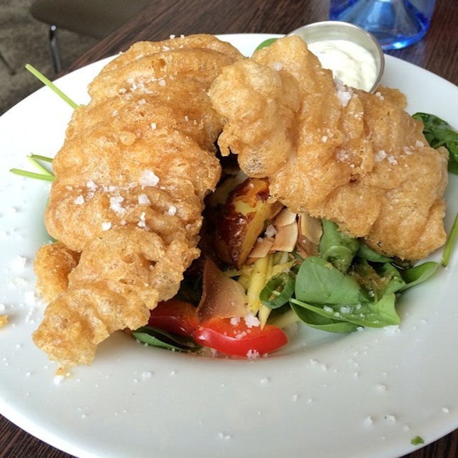 Breaded Wolf Fish served with crispy potatoes and mango salad @ Icelandic Fish & Chips