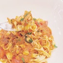 Fresh Fettuccine Pasta with Crab Meat, Tomato Sauce and Chili ($20).