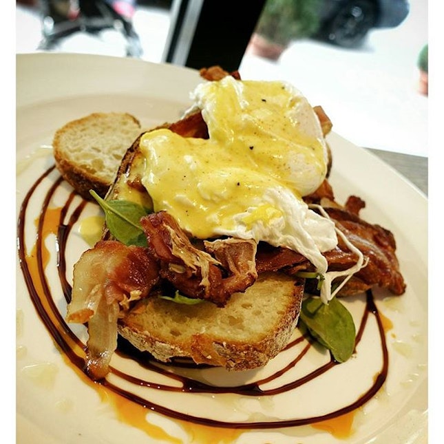 Eggs Benedict (crispy bacon) $17 - Two poached eggs served on toasted B&C Pain Miche Bread topped with hollandaise sauce with a hint of balsamic glaze and chilli oil.