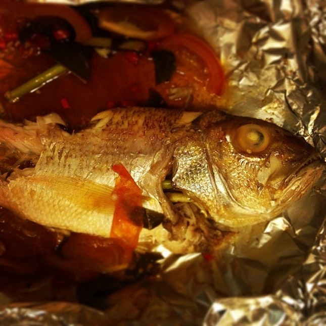 Managed a baked red snapper today with fresh lime leaves, lemongrass, tomatoes, soy sauce and a dash of 花调酒.