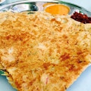 Vegetable Rawa Thosai - South Indian pan seared semolina or suji bread with onions and vegetables served with caramelised onions and spicy coconut chutney - RM2.00.