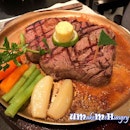 Enjoying Sizzling Steak over the hot plate.