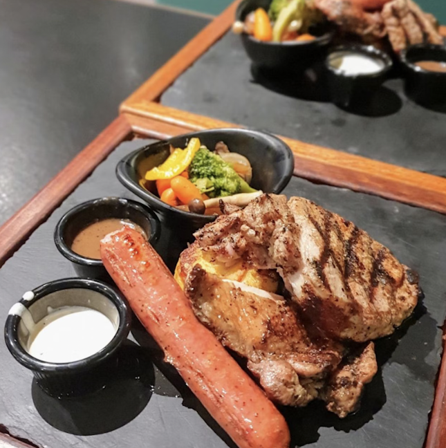 For 1-for-1 Signature Grilled Chicken Chop and Summer Kabana Pork Sausage with Forest Mushroom Soup and a choice of Premium Iced Tea (Mon-Thu) save (~$32)