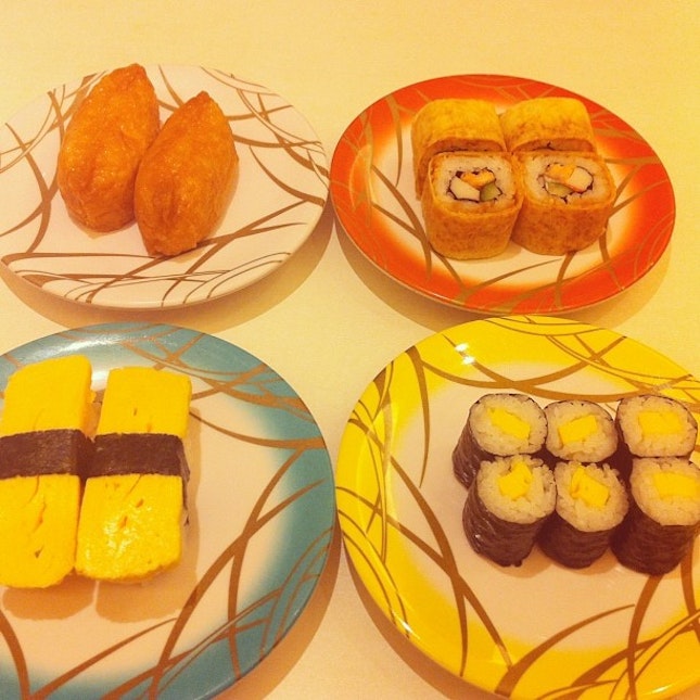 from top left; clockwise: inari sushi, fried salmon roll, tamago maki, tamago