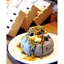 Charcoal Pavlova (220 baht) is a fresh cream filled charcoal meringue, topped with passionfruit.