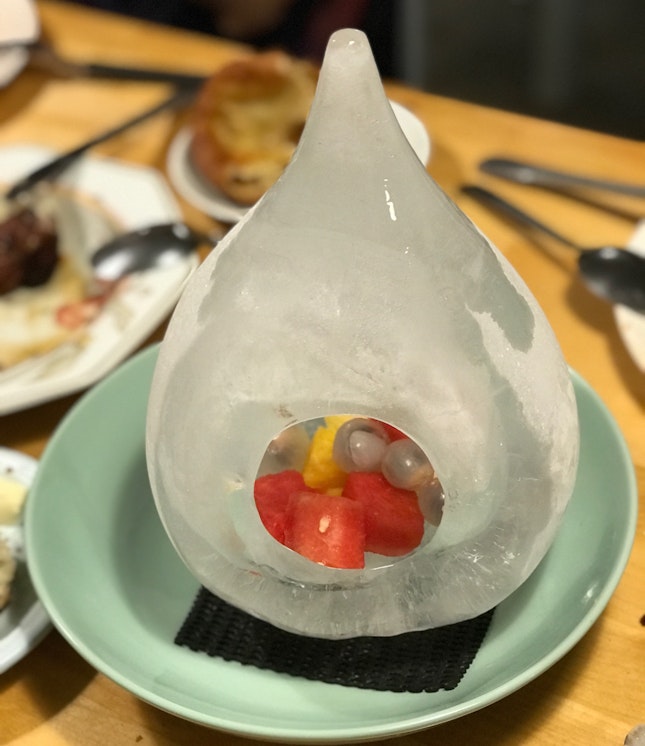 Complimentary fresh fruit presentation in ice teardrop.