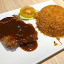 Macau fried rice (which is tomato fried rice) with chicken cutlet.