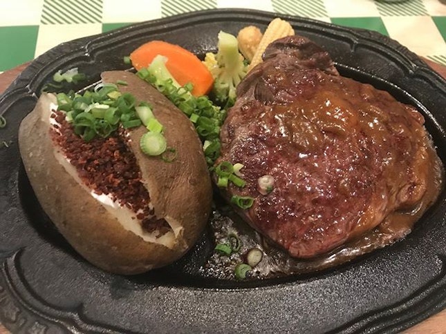 NZ Ribeye Steak served with a whole potato with condiments like bacon bits @jacksplacesg @safrapunggol They are having an awesome promo now for this meal at $12++ only on Mon and Tues.