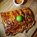Slow grilled ribs with a very sweet BBQ sauce.