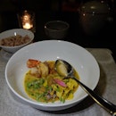Mekong langoustine clear curry with water lily stern, sesbania flowers and pounded java feroniella .