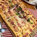 “Flammkuchen” Crispy Flatbread With Bacon | $19.90