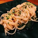 Angel hair wakame with tamago furikake, lobster essence and rayu oil.