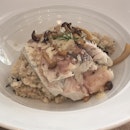 Poached seabass with mushroom risotto