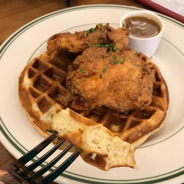 Chicken & Waffles [$21] With honey-Tabasco sauce drizzled over a soft vanilla buttermilk waffle, and our signature warm maple butter