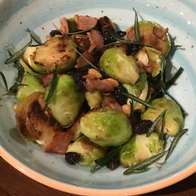 Charred Brussel Sprouts with bacon, pine nuts and raisins [$16]