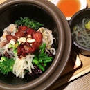 Black rice bibimbap with grilled pork and citron soy sauce