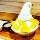 Mango Bingsu  Fresh mango on milk shaved ice and soft serve, topped with mango sauce  Pour the thick and creamy condensed milk over the soft and fluffy shaved milk ice and savour the refreshing dessert.