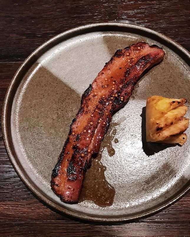 The menu calls this 'bacon chop and roasted pineapple'.