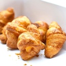 Mini salted egg croissants at just $1 each.