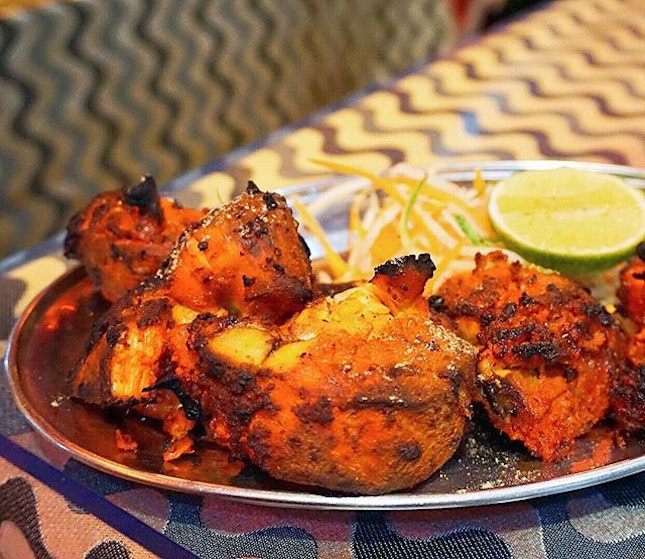 King of Tandoor, Tandoori Chicken ($14/Half) Tender fresh chicken thoroughly marinated in yogurt, rare spices, lime juice & saffron; and passionately barbecued in clay oven over burning charcoal.