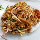 The famous Char Kway Teow in Kampar (RM3, Sgd1); The uncle who sat on the stool while whipping up the dish!