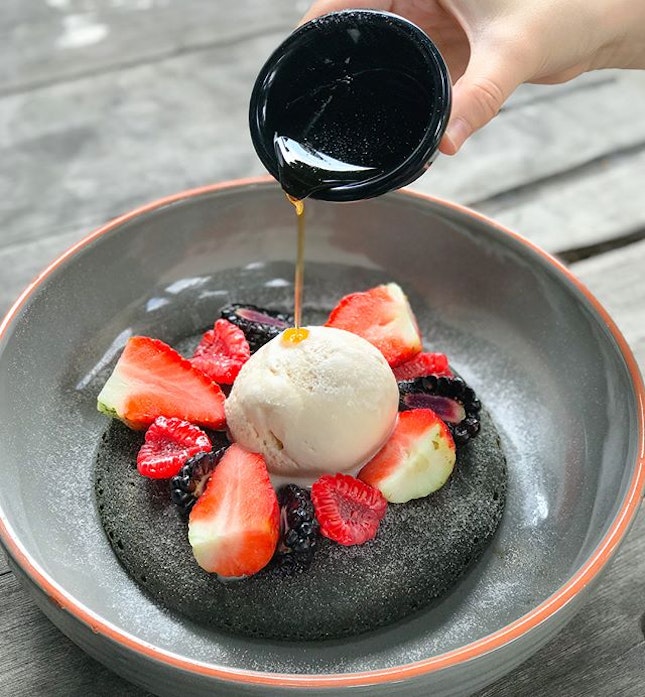 Earl grey charcoal hotcake [$15] Charcoal hotcake topped with fresh assorted berries, salted caramel ice cream and served with a side of earl grey infused maple syrup.