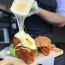 Crispy breaded fish burger with Raclette cheese [$13.50] .