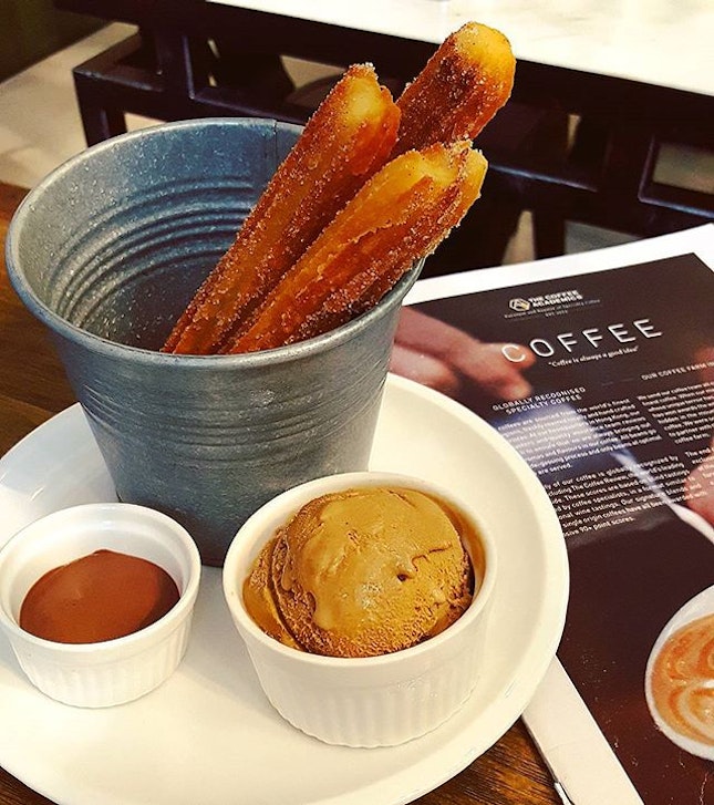 The Academics Cinnamon Churros (freshly fried Mexican churros w molten core sprinkled w cinnamon sugar, served w a scoop of TCA blend gelato & Varlhona 70% choc fudge dipping sauce).