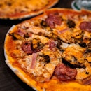 Meaty, greasy and full-bodied are some adjectives used to accurately describe the Misto Carne pizza at Modestos.