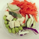 Food: raw carrot , edamame , purple cabbage, tofu , cucumber.
