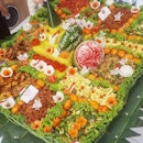 A huge Tumpeng (yellow rice with assorted veggies and meat served in a traditional celebration in Indonesia) to celebrate a shop's grand opening and Indonesia's Independence Day.