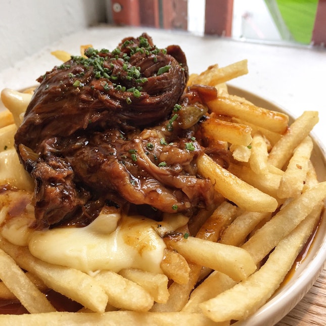 Poutine ($14) — Shoestring fries, melted cheese, beef chunks 