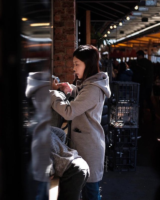 A candid shot of her ordering food at South Melbourne Market.