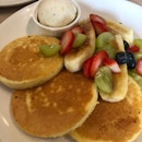 Buttermilk Pancakes With Fruits And vanilla Ice Cream