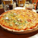 Peperoni's thin crust XXL pizza was almost the size of the table and came loaded with fresh ingredients.