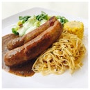 Grilled Bratwurst [$9.50] 
This grilled Bratwurst is served with pasta, salad and corn.