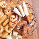 Sharing a platter of finger food at Muchos with the family.