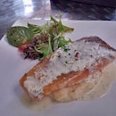 Smoked salmon with mashed potatoes and greens - something fishy is going on here - something that's crispy on the exterior and almost Springy on the inside.