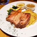 Chef george with 50 years of culinary experience serve authentic german and swiss cuisine.( shall not explain the long history)

Grilled Smoked Pork Chop with apple sauce:
The pork is tough and slightly salty but the gratin is sooo good.