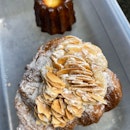 Almond Croissant ($6), Canele ($3)