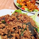 Stir-fried minced chicken with Thai basil and century egg (Kraphoa Gai Kai Yeow Maa) .