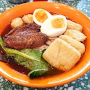 Yuan Long boy ($11.80++) Spicy curry noodle with soft boiled egg, braised chicken wing, curry fishball, beancurd puff.