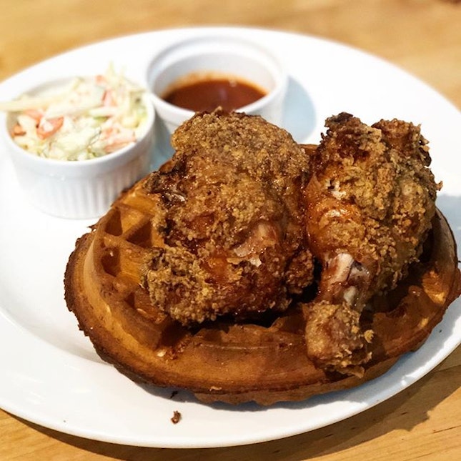 Fried chicken & waffles ($22)  Deep fried buttermilk chicken served on a whole crispy waffle with maple syrup drizzle and coleslaw.