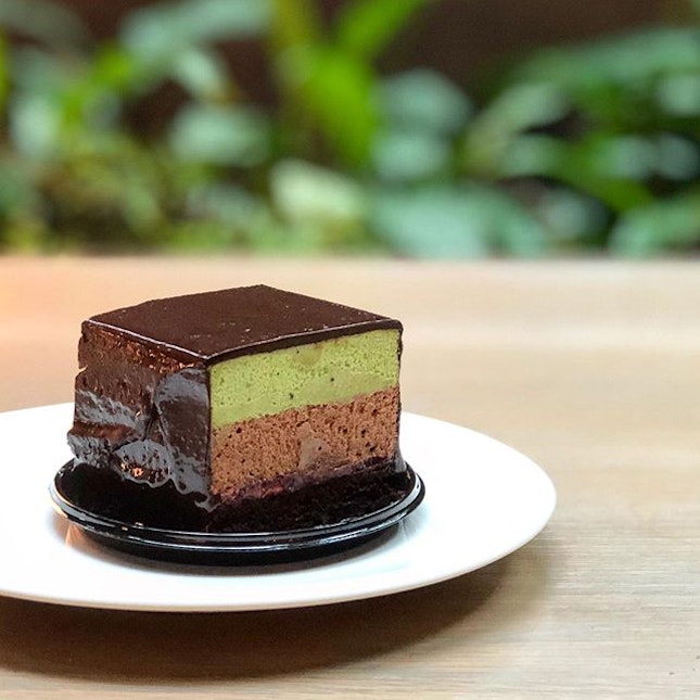 Matcha chocolate mousse cake with a brownie base.