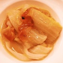 Simmered baby cabbage and mushroom in bouillon.