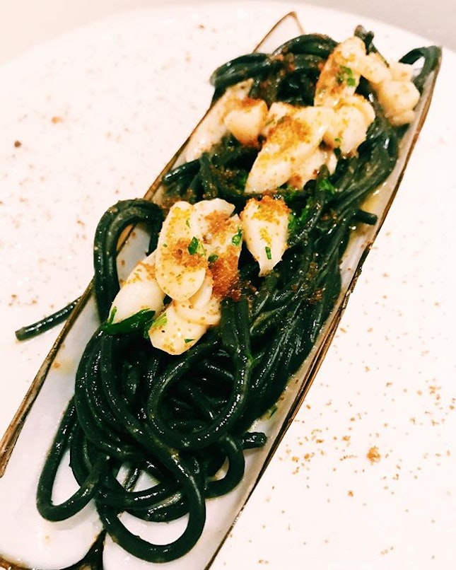 Squid ink tonnarelli with Scottish bamboo clams, topped with bottarga (salted and cured fish roe).